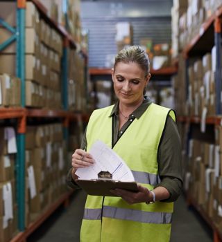 Woman On Site Holding Clipboard