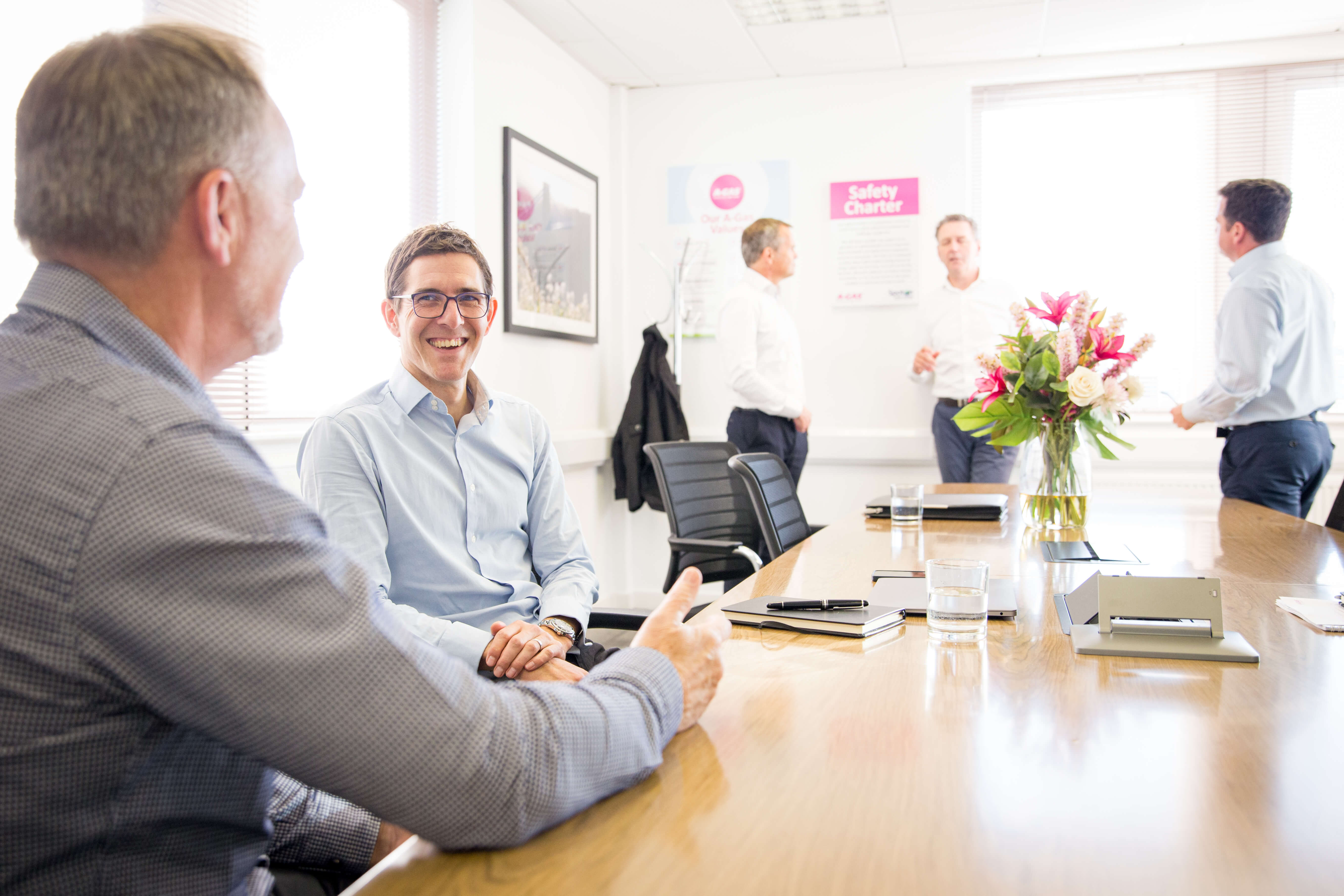 Exec Around The Table In Boardroom