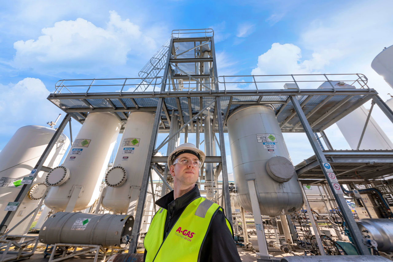 Technician Standing by Separators